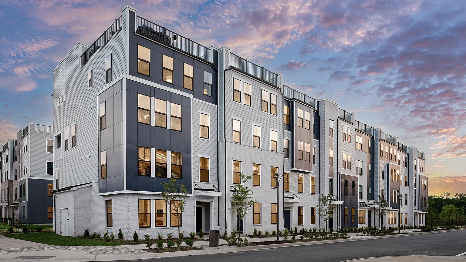 The Kincora Residence — Exterior of the townhouse condo building at Kincora at dusk