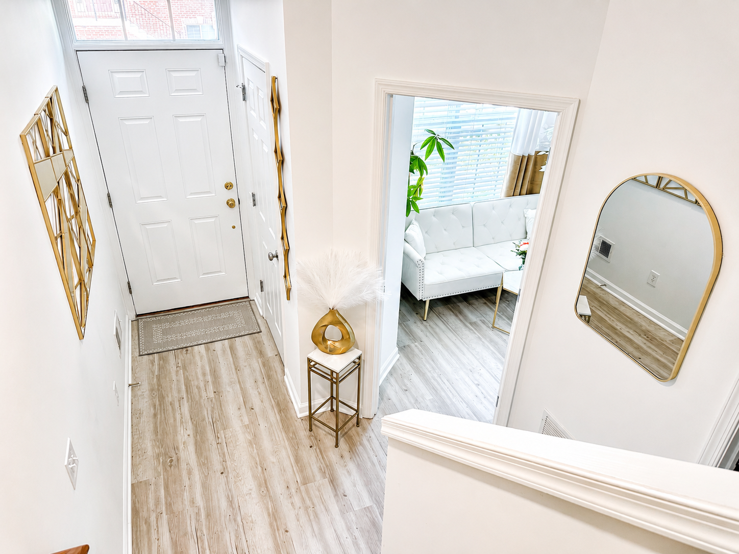 The Ashburn Residence — Entry foyer and stairwell with gold accents