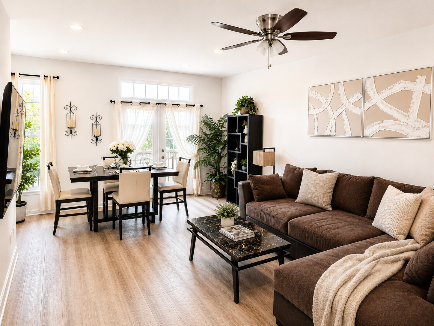Bright furnished living and dining area at The Ashburn Residence with warm natural light