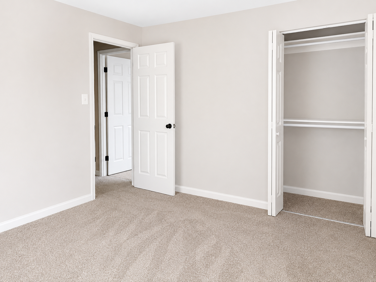 The Leeway Residence — Third bedroom with neutral carpet and bi-fold closet