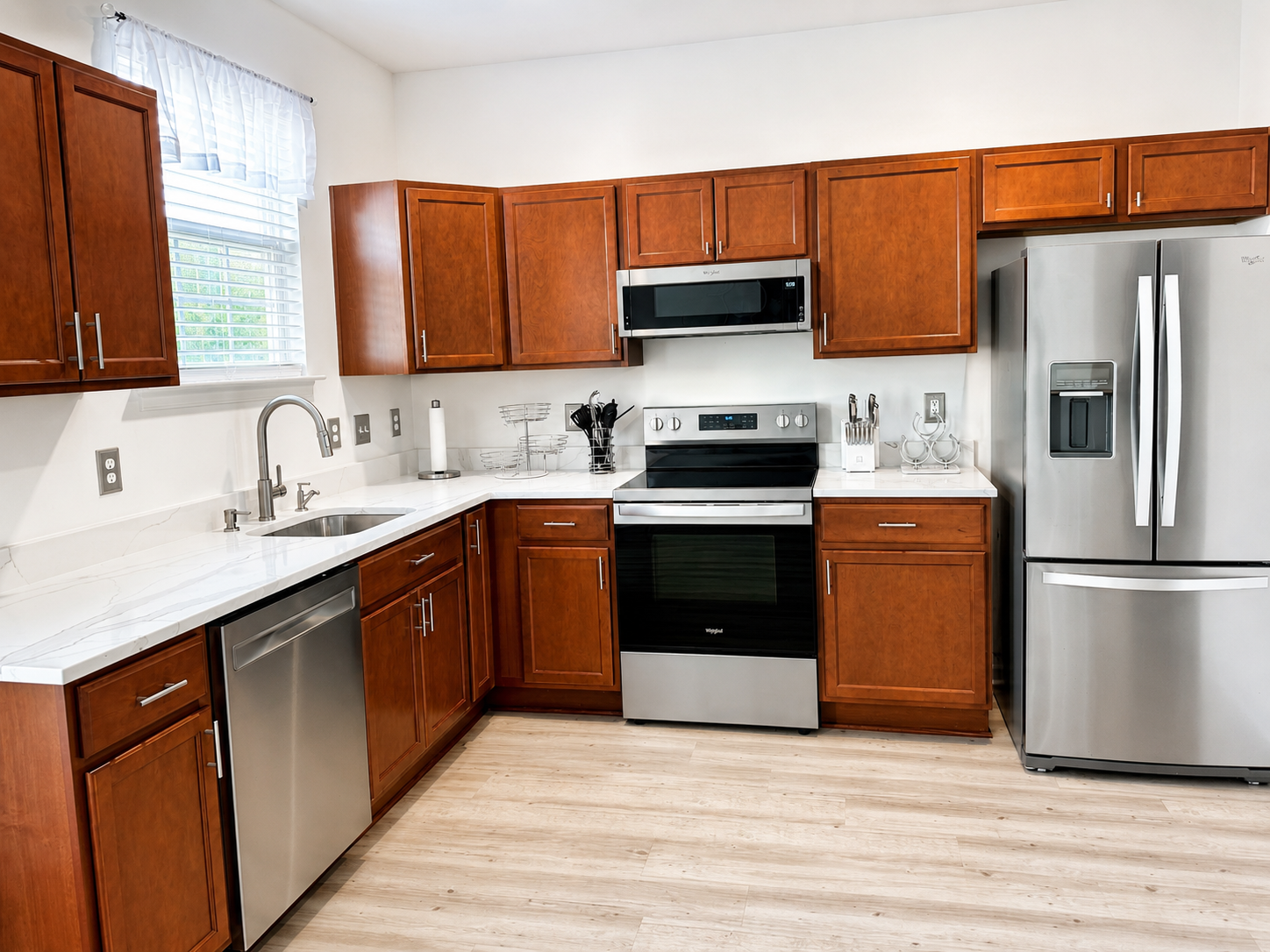The Ashburn Residence — Kitchen with quartz counters, stainless appliances, and cherry cabinetry