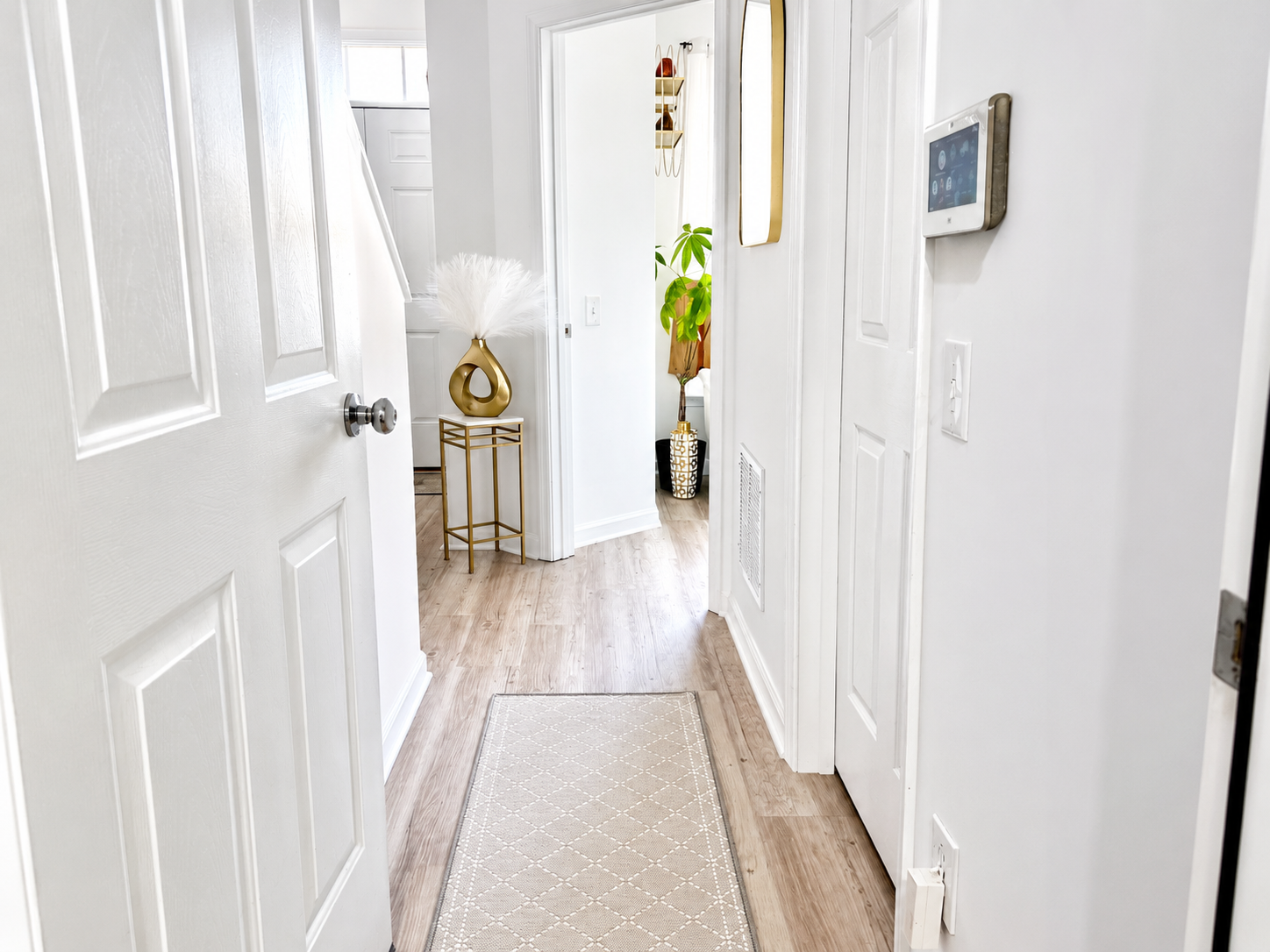 The Ashburn Residence — Upstairs hallway with light wood floors